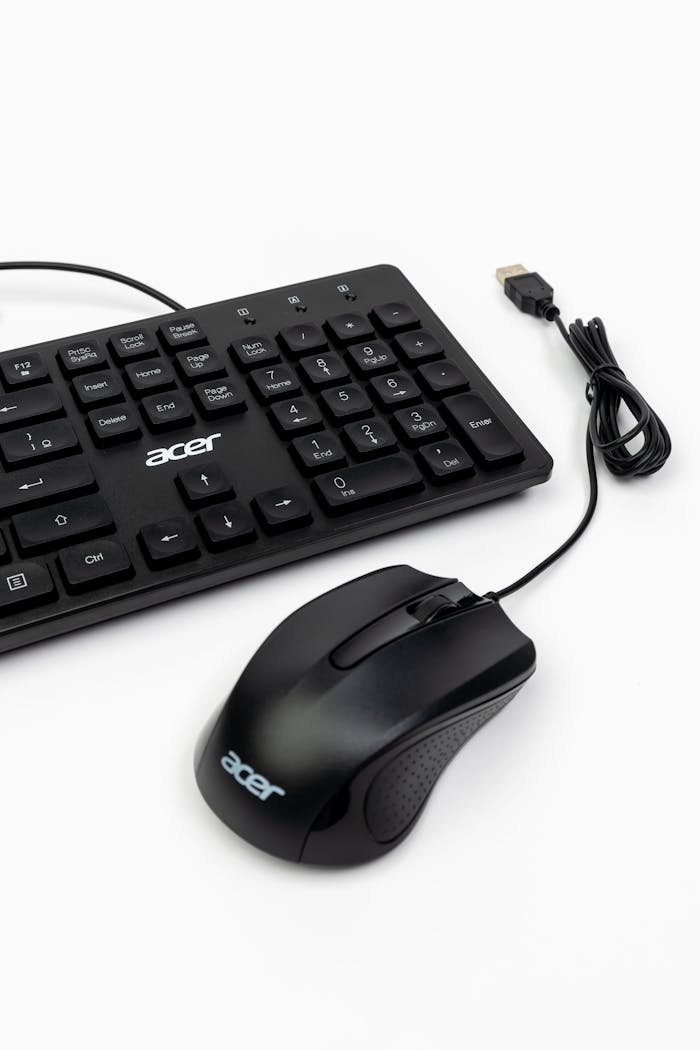 Close-up of a black Acer keyboard and mouse set against a white background.